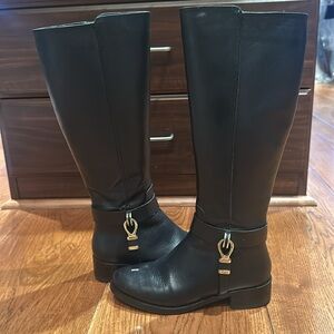 Barney’s New York tall black riding boots. In good condition.
